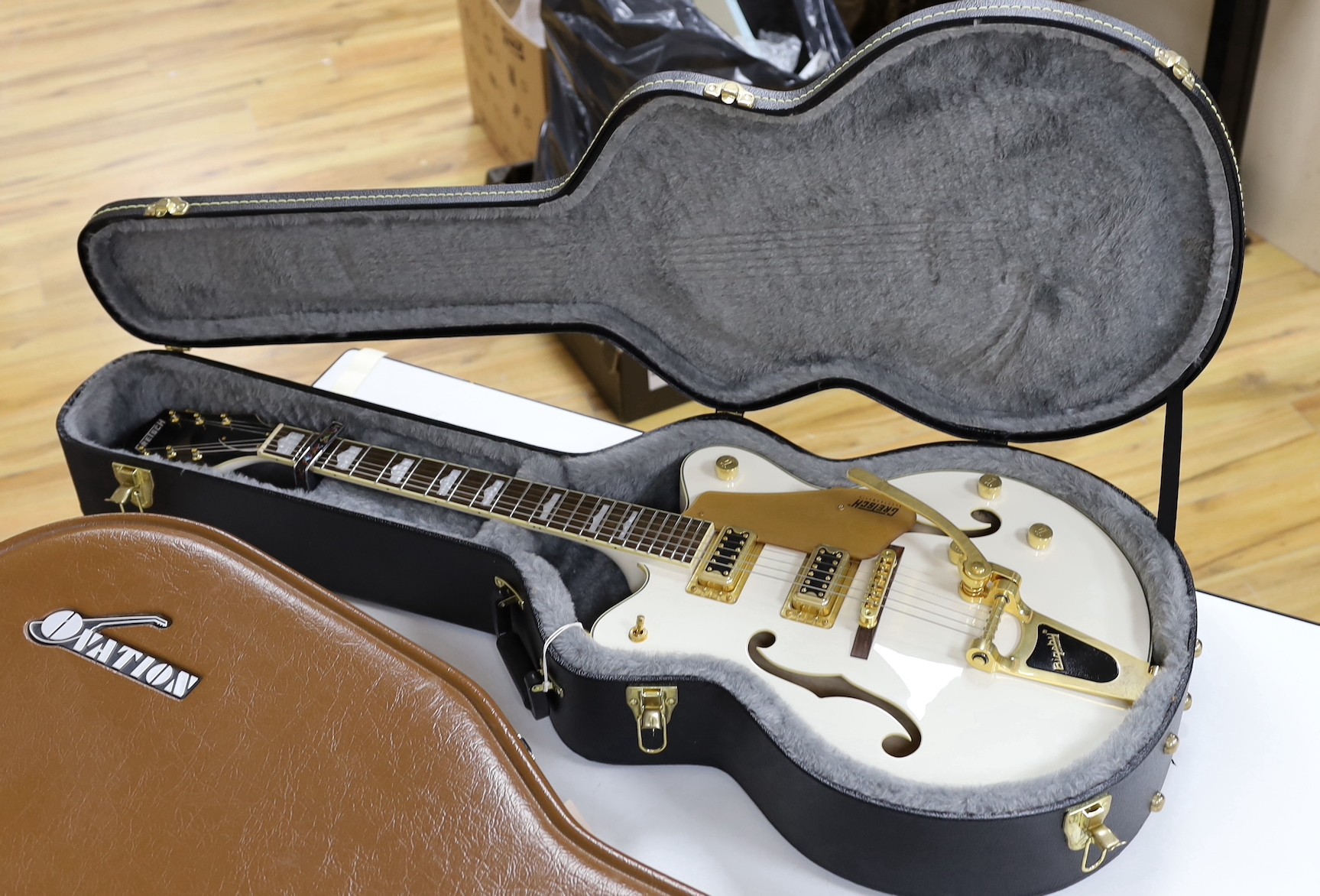 A Gretsch Bigsby electromatic guitar with case